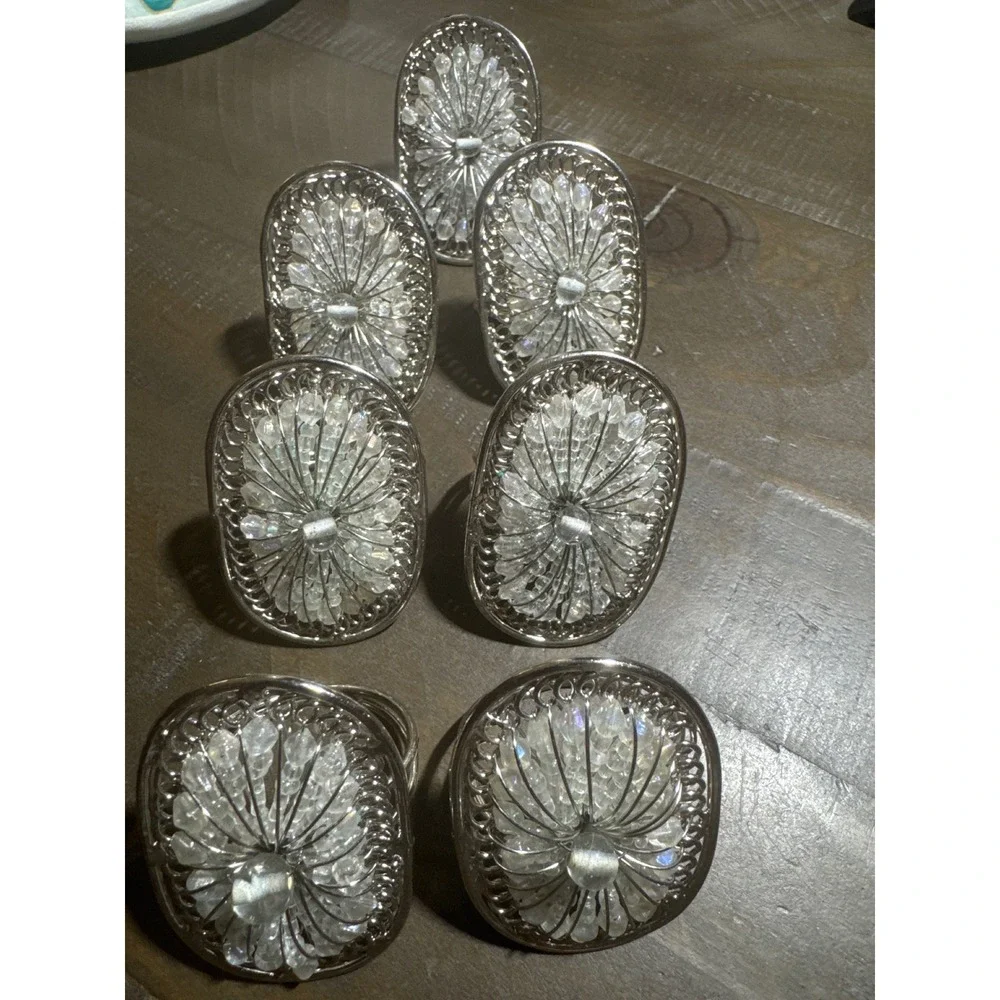 Pier 1 Set of 7 Silver Tone Beaded Filigree Oval Napkin Rings Clear Starburst
